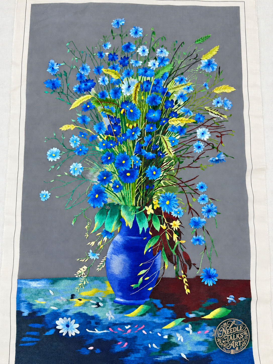 Full view of unframed A Quiet Rhapsody in Blue floral silk embroidery with fabric margins visible.