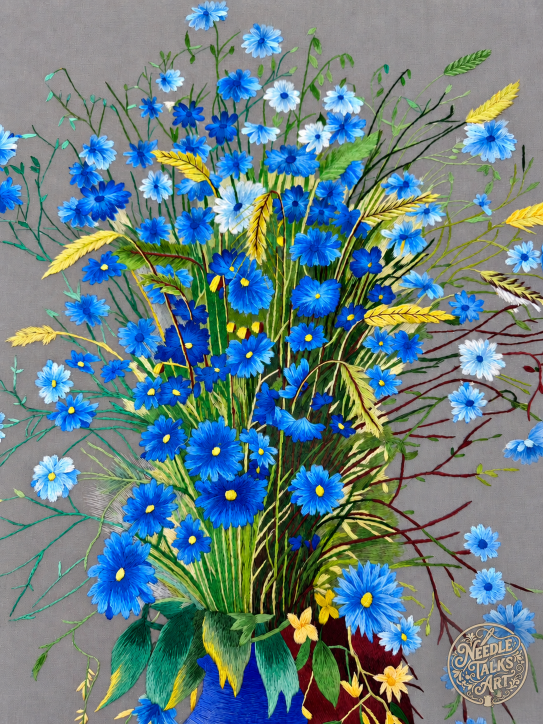 Close-up of blue embroidered flowers, green stems and yellow sprigs in A Quiet Rhapsody in Blue.