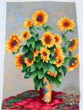 Where Sunshine Stays silk embroidery: yellow sunflowers and green leaves in a tall vase on red fabric.