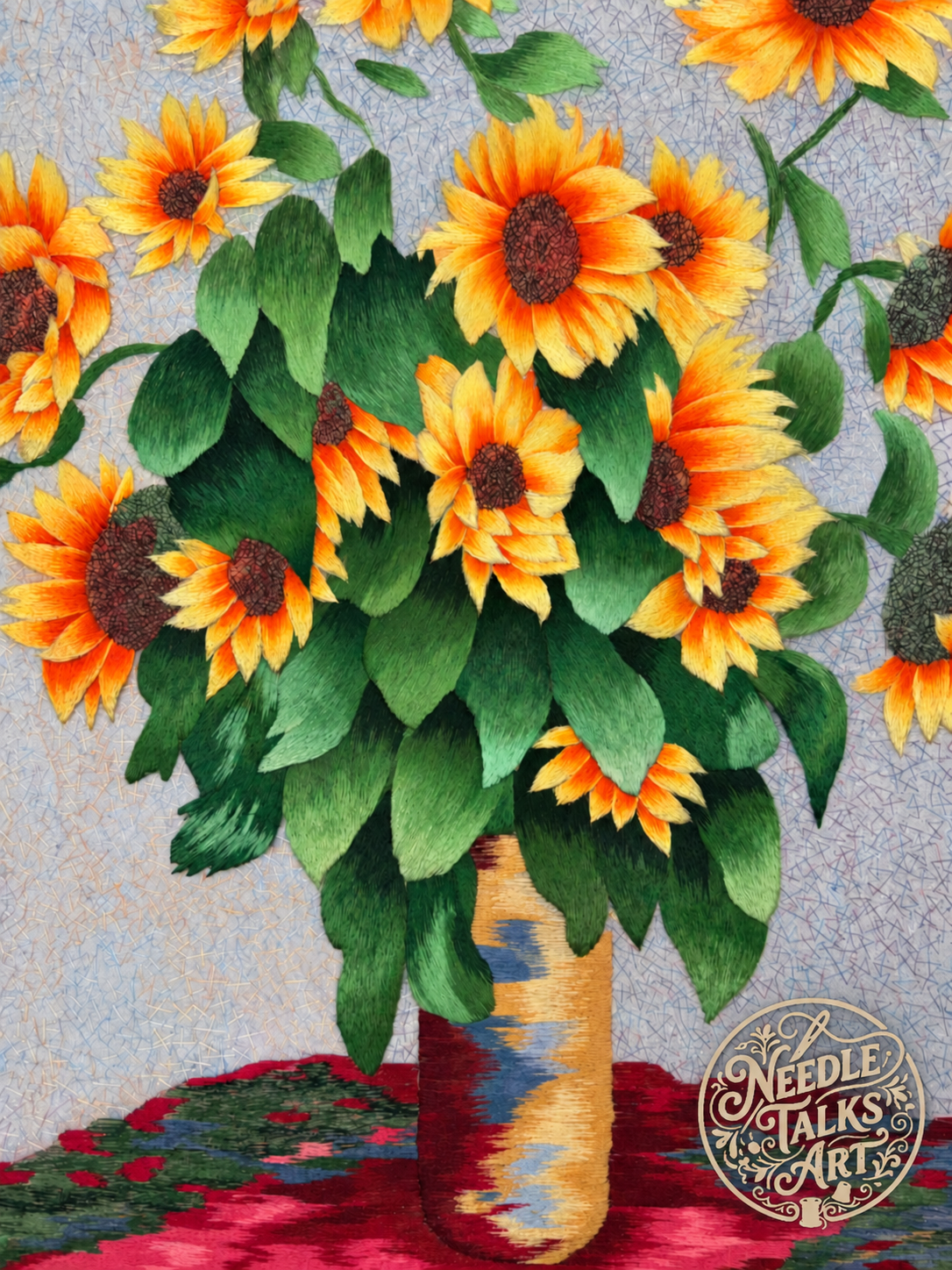 Detail of Where Sunshine Stays embroidery showing sunflowers, layered green leaves and a gold-toned vase.