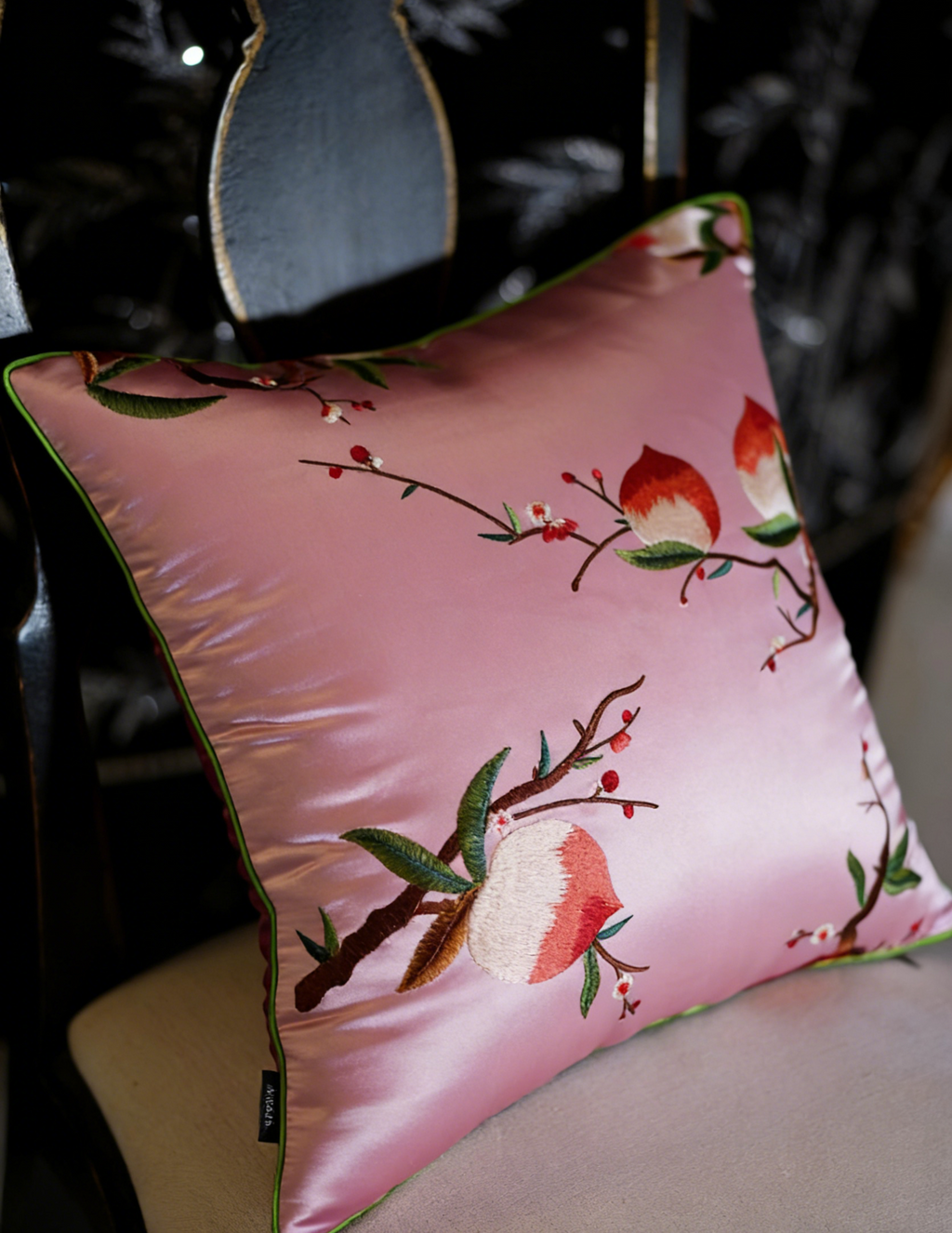 Decorative pillow with floral design on a chair