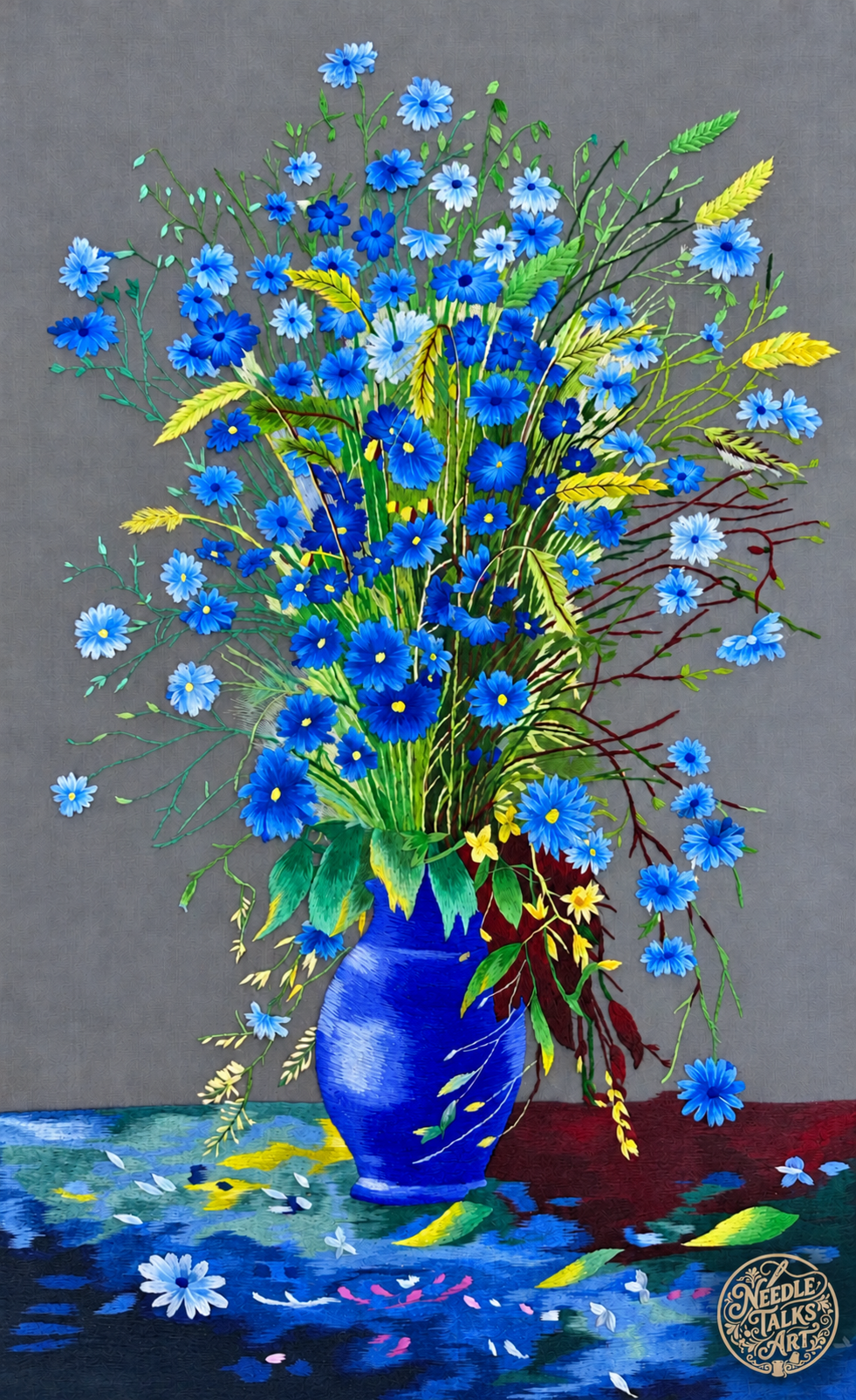 A Quiet Rhapsody in Blue silk embroidery: blue flowers and yellow accents in a blue vase on a gray background.