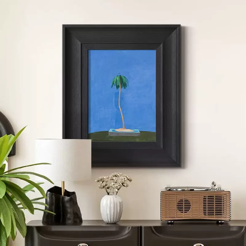 Modern tropical wall art with a black frame, perfect for coastal home decor and minimalist interior design. This unique palm