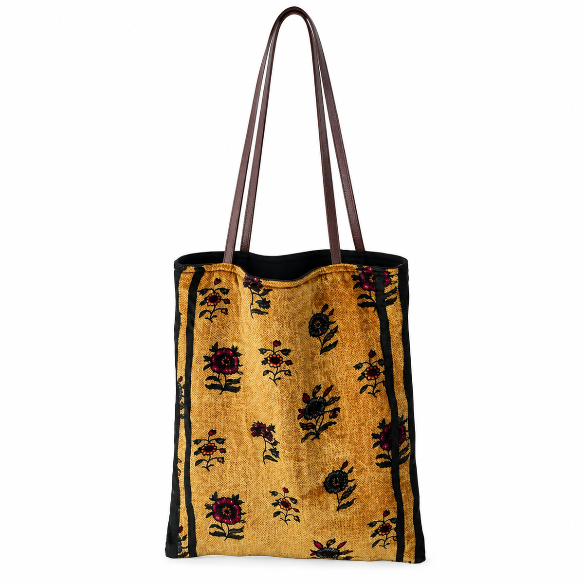Golden ochre floral silk velvet tote bag with black botanical motifs and brown shoulder straps, front view on white.