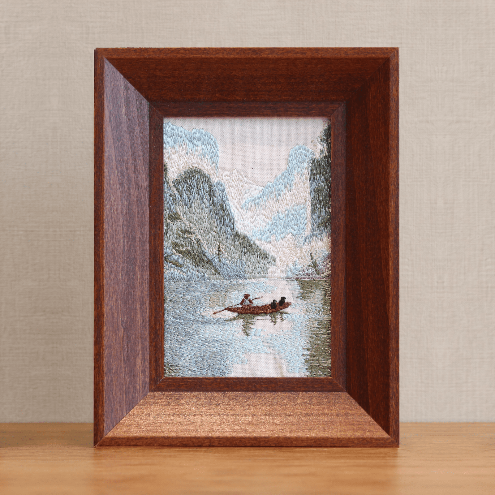 Front product view of Guilin karst landscape embroidery in a brown wood frame