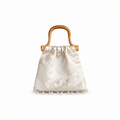 Ivory plum blossom jacquard handbag with woven rattan handle and pearl fringe, front view on white.
